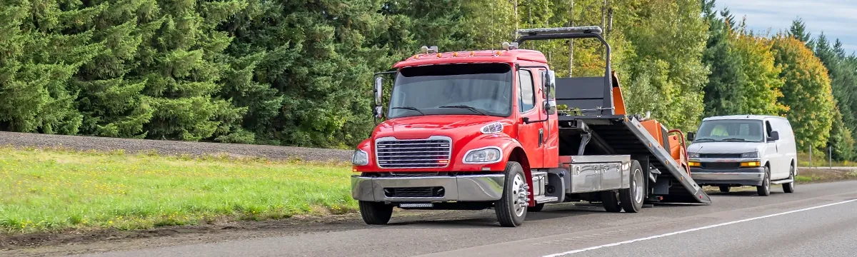 Wolf Power Sports tow truck on the road in the Tampa area