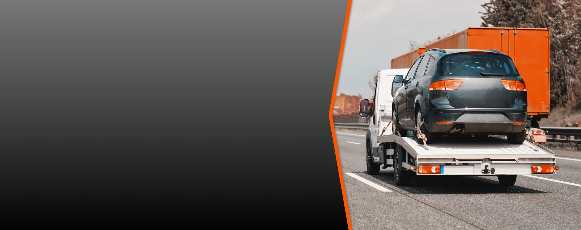 Wolf Power Sports flatbed tow truck hauling an SUV on a Florida highway