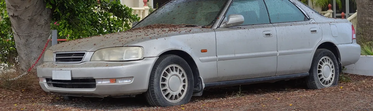 Old vehicle being hauled away for junk car removal in Tampa, FL
